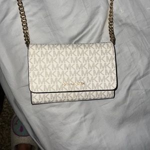 Michael Kors purse grey pattern gold chain pink strap
